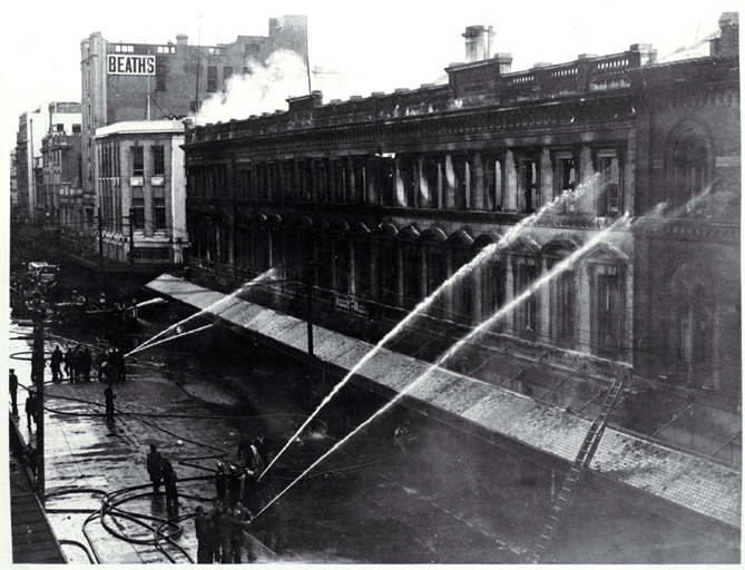Firemen dampening down Ballantyne's building, Christchurch 