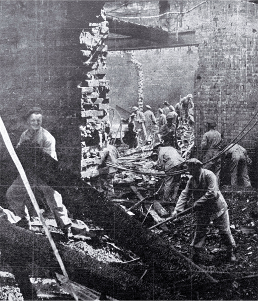 Soldiers work amongst the debris 
