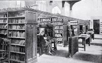 In the Canterbury College Library : the Acting Librarian, Mr Hardie, is seen facing the camera.