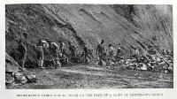 Co-operative labourers at work on the face of a cliff at Patterson's Stream 