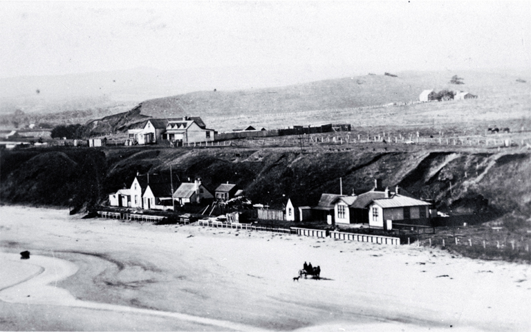 Waitangi showing Odman's and Heslop's hotels at the left : to the right is the combined post office and courthouse.