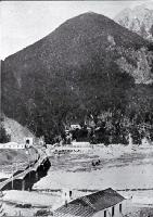 Otira portal to the Arthur's Pass tunnel with Rolleston Spur in the background and Rolleston River in the foreground 